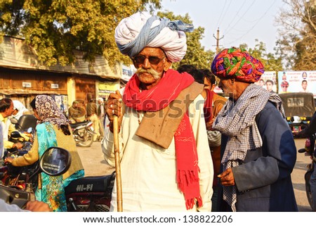 BUNDI, INDIA - JANUARY 23: Portrait of an old man in a traditional turban on the street of the city on January 23, 2012 in Bundi, India. Turbans reflect  culture, profession of person.