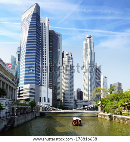 SINGAPORE - FEBRUARY 03, 2014: Singapore skyline with Cavenah Bridge. View includes next buildings: Maybank, Capital Tower, Overseas Bank Plaza, OUB Centre, UOB Plaza One, OSBC, SingTel and ect.