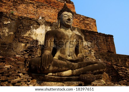 Thailand, Sukhothai Historical park. Statue of a sitting deity in historical park Sukhothai.