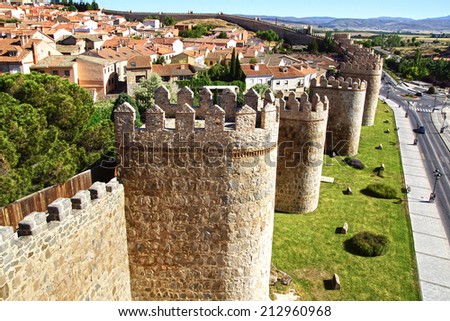 AVILA, SPAIN - JUNE 08, 2014: Old Fortress Walls. The centre of the city is completely encircled by two kilometre long 11th century walls, punctuated by 88 towers and 9 gateways