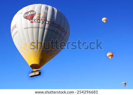 GOREME, TURKEY - OCTOBER 21, 2014: Hot Air Balloon Flights over the spectacular and breathtaking lunarscape of Cappadocia. Hot air ballooning is very popular thanks to the amazing landscapes.