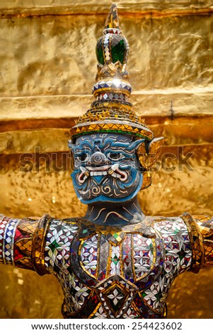 Demon guardian statue at the temple Wat Phra Kaew in the Grand palace, Bangkok, Thailand.