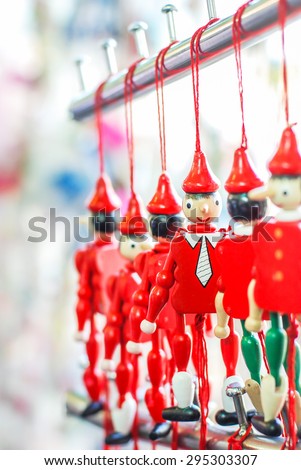 Funny souvenirs wooden Pinocchio marionettes and magnets