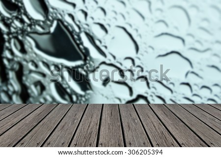Empty wooden deck table with Water drops on metal surface. Abstract background