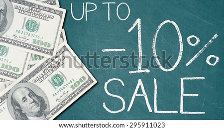 UP TO -10% SALE text written on a green chalkboard with frame made of 100 US dollars.