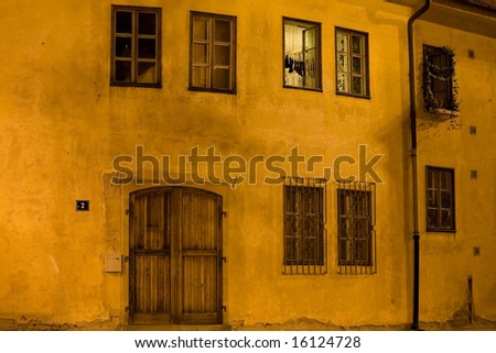 Summer night windows on house in Prague Old Town.