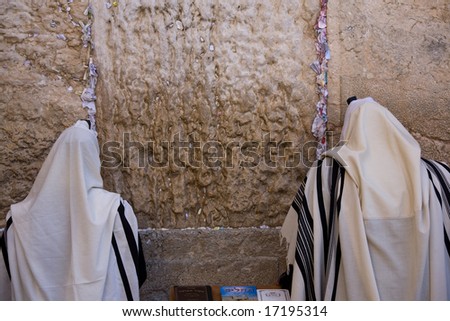 Praying Jews on Jerusalem Western wall during sabbath.