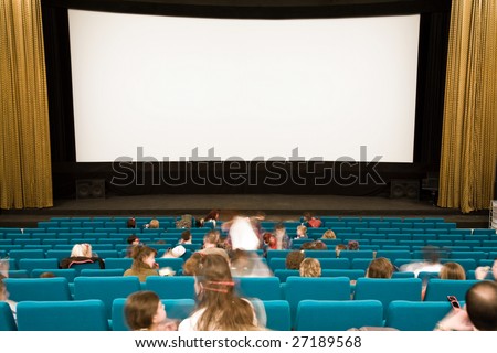 Cinema auditorium with people waiting in green chairs on movie performance. Ready for adding your own picture.