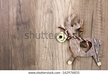 christmas decoration with wood background, snow, elk