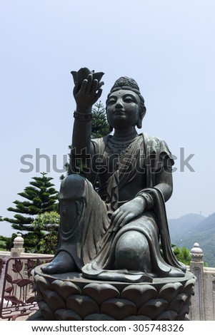 the statues of buddhist religious statues in tian tan buddha on top of ngong ping plateau in lantau island in china.