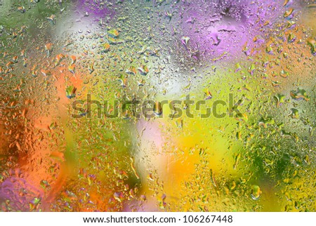 Close-up of small drops on rainy window.