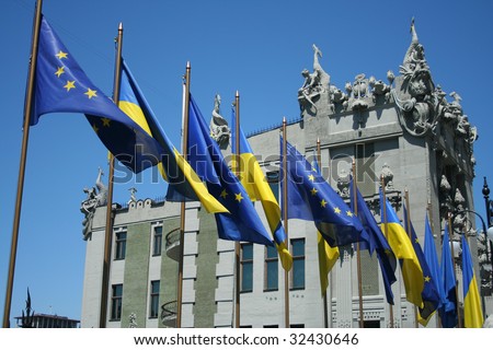 National and Europe Union flags near  House with Chimeras.