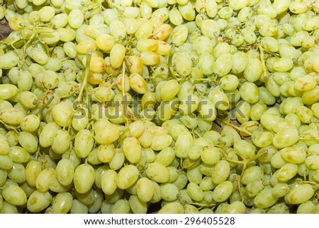 Juicy health booster power health fruit freshly cut white grapes on an open air fruit market stand.