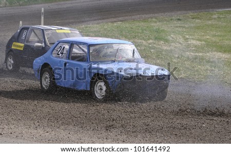 ISATRA, SWEDEN - APRIL 28: Unidentified people in first competition. Organizes smk Sala. Official name are folk-race, at old wrecked cars stock in Isatra, Sweden on April 28, 2012.
