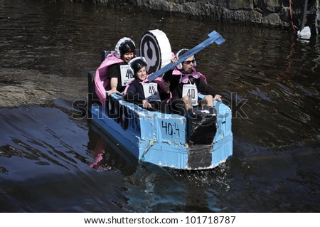 UPPSALA, SWEDEN - 30 APRIL: Unidentified people at the boat race. The official name is forsranning. Organizes are Uppsala technology and naturvetarkaren, at Uppsala, Sweden April 30, 2012.