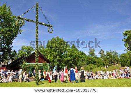TORSTUNA, SWEDEN - JUNE 22: Unidentified people in folklore ensemble in traditional folk costume.The official name is midsummer event and org are hembygd Torstuna on June 22, 2012 in Torstuna Sweden