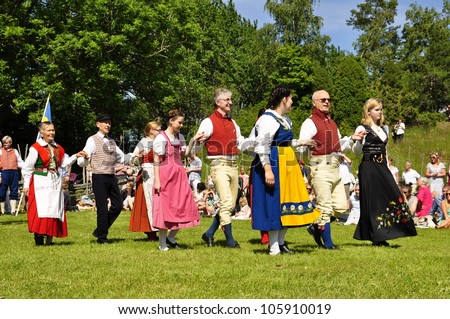 TORSTUNA, SWEDEN - June 19:  Unidentified people in folklore ensemble in traditional folk costume. The official name is midsummer event and org are hembygd Torstuna on June 22, 2012 in Torstuna Sweden