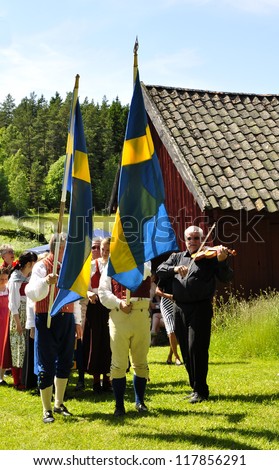 TORSTUNA, SWEDEN - JUNE 22: Unidentified people in folklore ensemble in midsummer event. Official name is midsummer event hembygd Torstuna on June 22, 2012 in Torstuna Sweden