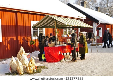 SATRA - BRUNN, SWEDEN - DECEMBER 09: Unidentified people in traditional christmas market  in Satra - Brunn. people look for a christmas gift on December 09, 2012 in Satra - Brunn Sweden.