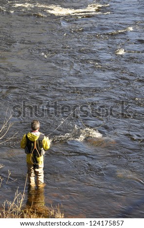 Fisherman catches in Swedish salmon river