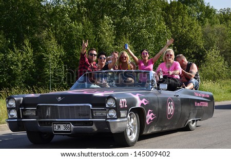 VASTERAS, SWEDEN - JULY 6: Unidentified people in power big meet cruising with old classic car.Official name is Power meet and organization are Power big meet on July 6, 2013 in Vasteras Sweden
