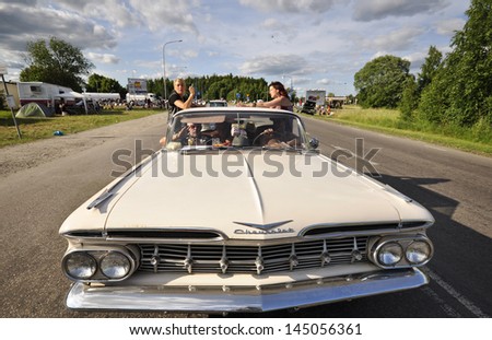 VASTERAS, SWEDEN - JULY 6: Unidentified people in power big meet cruising with old classic car. Official name is power meet and organization are power big meet on July 6, 2013 in Vasteras Sweden