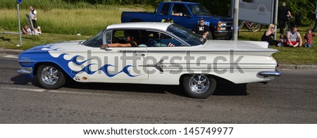 VASTERAS, SWEDEN - JULY 6: Unidentified people in power big meet cruising with old classic car. official name is power meet and organization are power big meet on July 6, 2013 in Vasteras Sweden