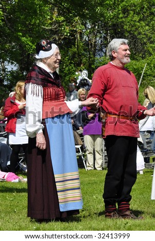 TORSTUNA, SWEDEN-JUNE 19: Folklore ensemble of Sweden in traditional costume at midsummer day June 19 2009 in Torstuna, Sweden.