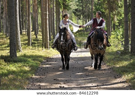 Princess bride and her knight on horses / wedding.