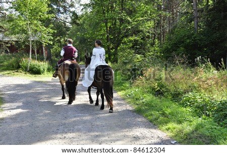 Princess bride and her knight on horses / wedding.