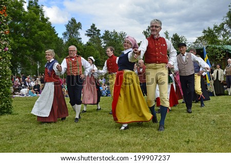 TORSTUNA, SWEDEN - JUNE 20: Unidentified people in folklore ensemble in midsummer event. The official name is midsummer event and organization are hembygd Torstuna on June 20, 2014 in Torstuna Sweden