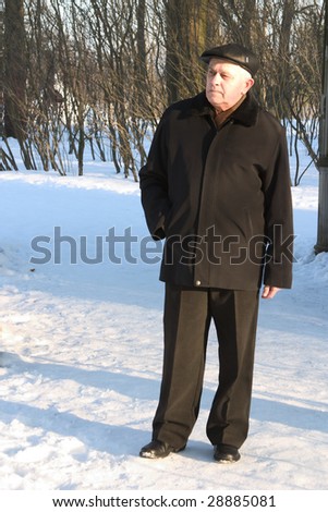portrait of senior man in winter park