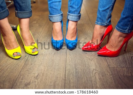 Yellow blue red shoes on female FEET