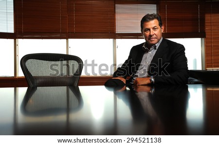 ISTANBUL,TURKEY FEBRUARY 20, 2012: The famous businessman Cem Boyner, chairman of executive board of BOYNER Holding, is posing to press