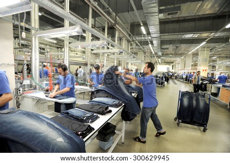 JULY 24,2014 - ISTANBUL,TURKEY. Textile is very important sector for turkish economy. At the same time this sector is generating employment. The workers are seen on the picture in a factory