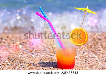 Glass of cocktails on the beautiful sandy beach, Cocktail - refreshing summer drink, photography