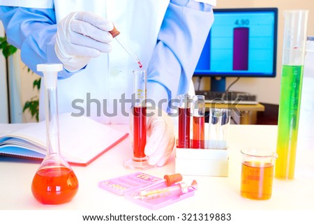 Laboratory technician performs testing of chemicals in the laboratory, Laboratory research, photography
