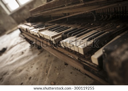 Close-up of an old piano keyboard in an abandoned auditorium in Pripyat. Chernobyl nuclear power plant zone of alienation