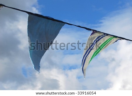 Celebration abstract of bunting flags flying against blue sky