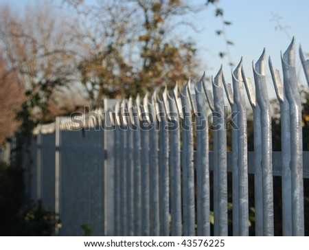 Spiked metal palisade fence