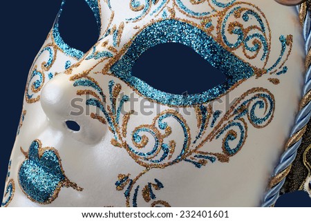 Isolated Blue Venetian mask on a blue  background