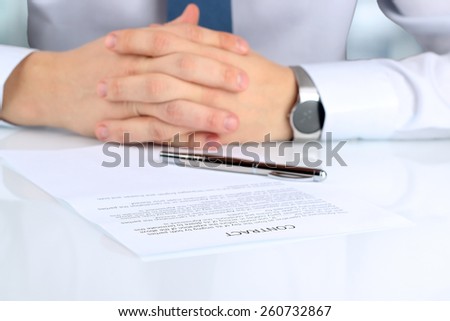 Businessman is doubting  about signing  a contract, business contract details