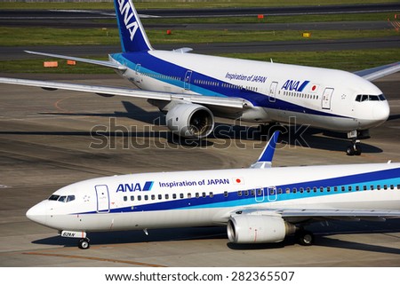 Tokyo, Japan - May 28: All Nippon Airways (ANA) B777-200 and B737-800 at Haneda Airport on May 28, 2015. ANA is a member of Star Alliance.