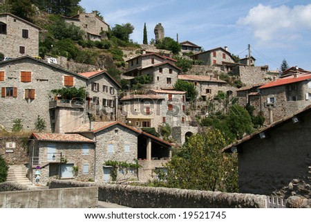 Stone houses on hill in Jaujac village, Ardeche mountains, France