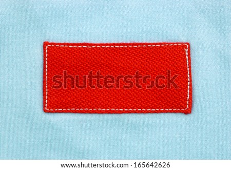 a red label on a blue material