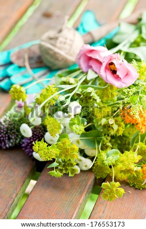 Several types of flowers laying on a table.