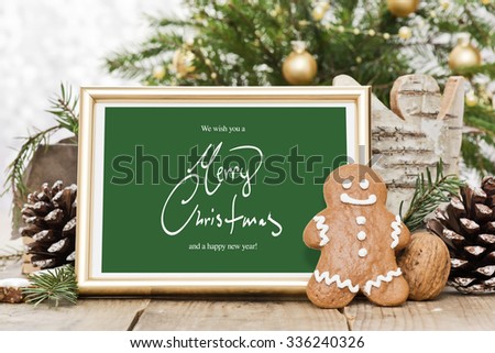 gingerbread man with golden frame and handwritten christmas greetings