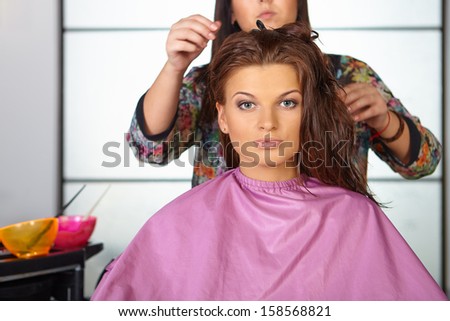 Hair salon. Women`s haircut. Combing.
