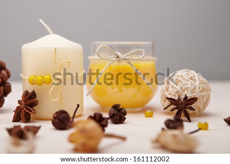 Background with candles and dried flowers.