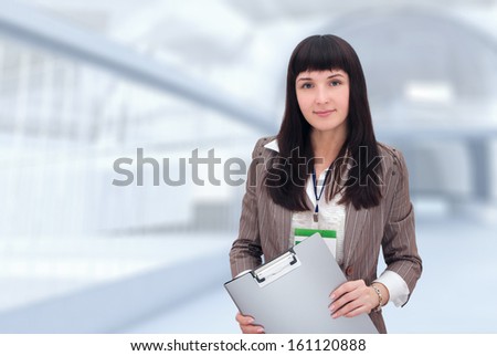 Businesswoman with document folder.